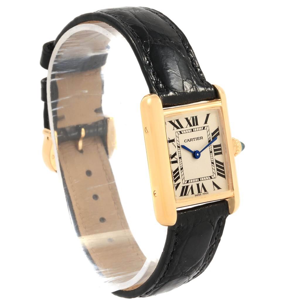 The image shows a side and front angle of the Cartier Tank Louis W129856 Women
s Yellow Gold Silver Dial W129856 Women
s Yellow Gold Silver Dial watch, highlighting its rectangular face, Roman numerals, and leather strap.