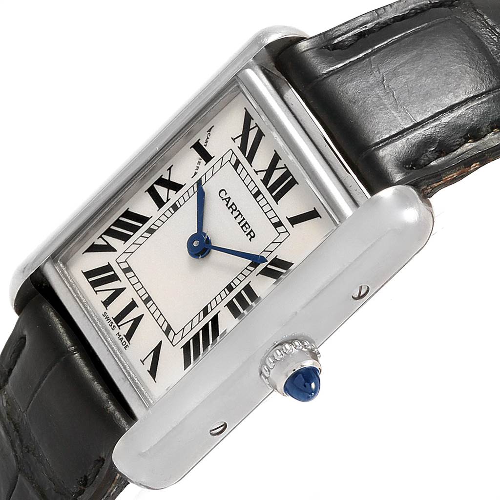 The image shows a close-up angle of the dial, case, and leather strap of the Tank Louis model by Cartier.