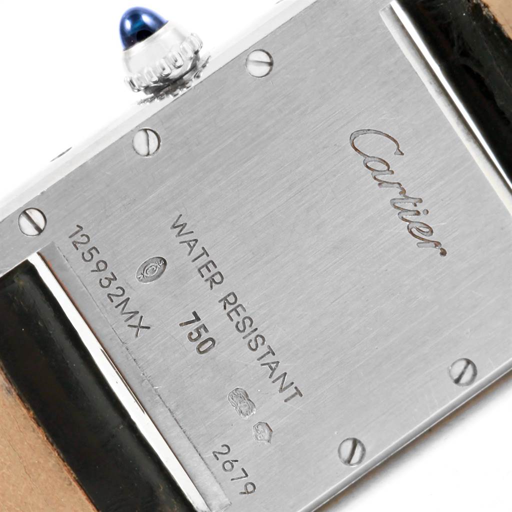 The image shows the back of a Tank Louis model by Cartier, displaying its water resistance, serial number, and crown details.