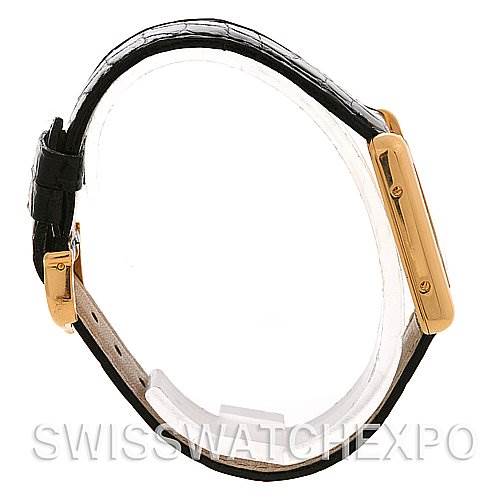 The image shows a side profile view of the Cartier Tank Louis W1529856 Women's Yellow Gold White Dial W1529856 Women's Yellow Gold White Dial watch, highlighting its black leather strap and gold-toned casing.