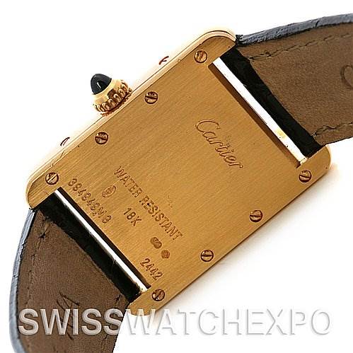 This image shows the back case of a Cartier Tank Louis W1529856 Women's Yellow Gold White Dial W1529856 Women's Yellow Gold White Dial watch, featuring the brand's logo and various engravings.