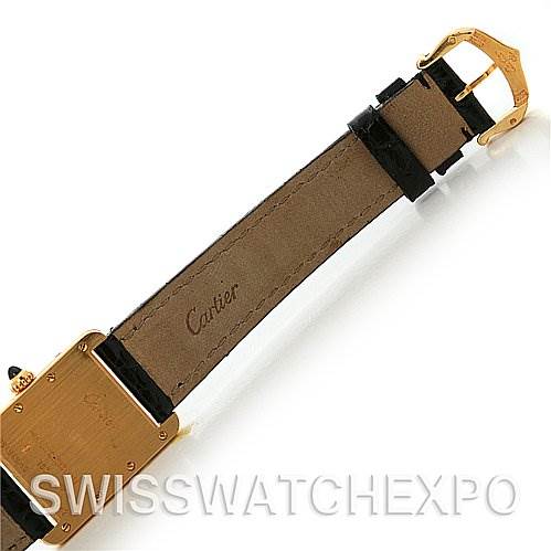 This image shows the underside of the strap and part of the case back of a Cartier Tank Louis W1529856 Women's Yellow Gold White Dial W1529856 Women's Yellow Gold White Dial watch.