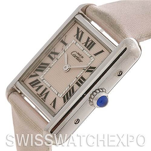 The Cartier Tank Louis Women's Stainless Steel Pink Dial Women's Stainless Steel Pink Dial watch is shown at an angled close-up view, highlighting its dial and crown with a blue cabochon.