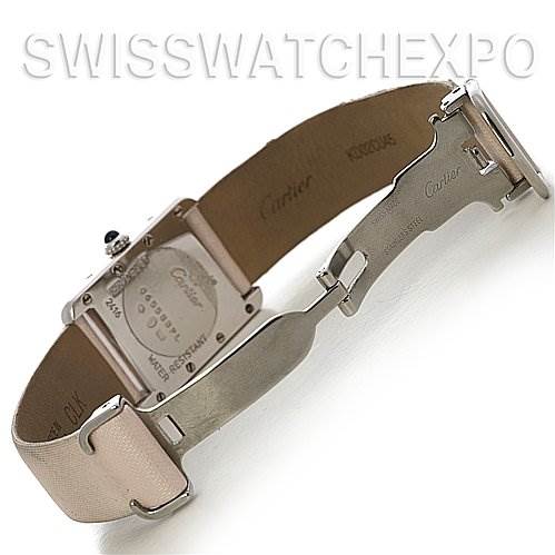 The image shows the back and clasp of a Tank Louis model by Cartier, highlighting the case back and a partially open leather strap.