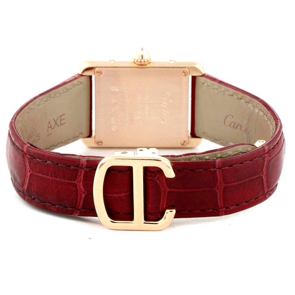 The image shows the back view of a Cartier Tank Louis WJTA0010 Women's Yellow Gold Silver Dial WJTA0010 Women's Yellow Gold Silver Dial watch, highlighting its case, red leather strap, and buckle.