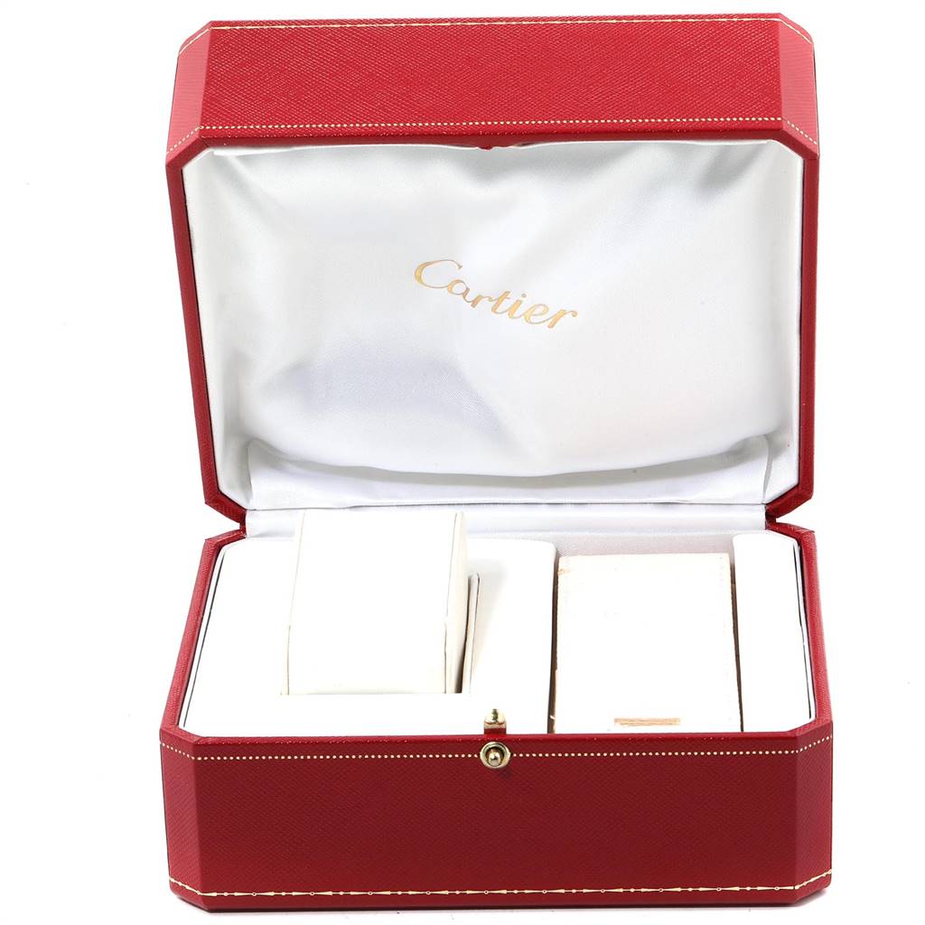 The image shows an open red Cartier box, likely for a Tank Louis model watch, with compartments for the watch and its accessories.
