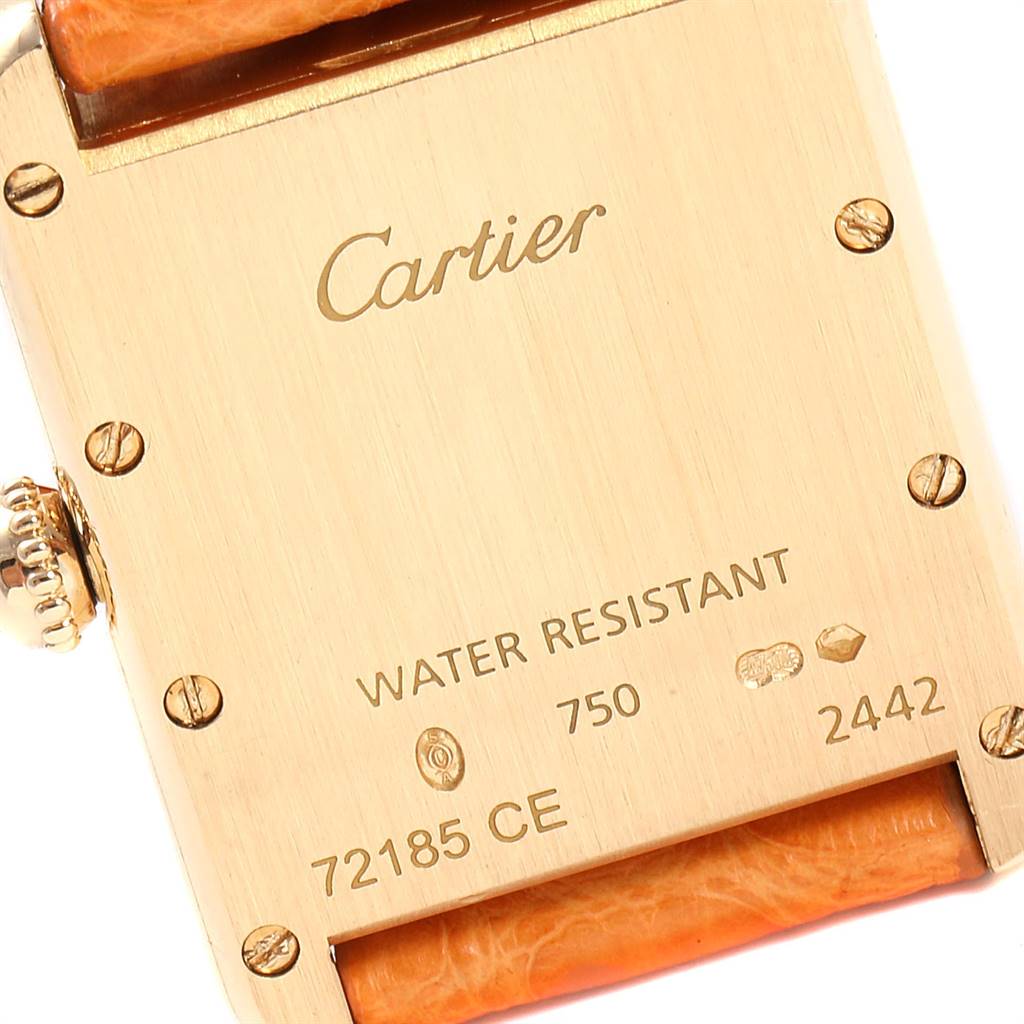 The image shows the back case of a Cartier Tank Louis W1529856 Women
s Yellow Gold Silver Dial W1529856 Women
s Yellow Gold Silver Dial watch, highlighting the brand engraving, serial number, and water resistance details.