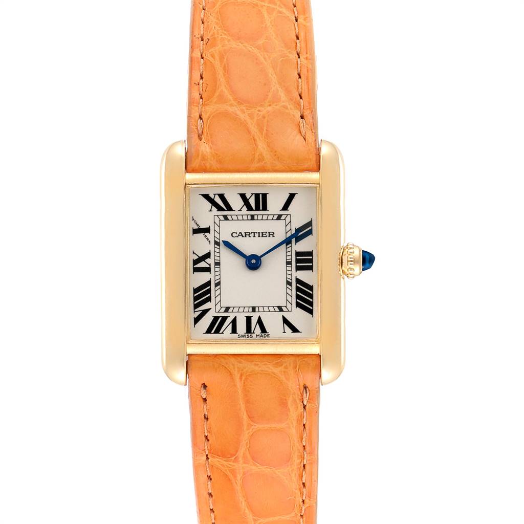 The image shows a Tank Louis watch by Cartier from a front angle, displaying the face, case, crown, and leather strap.