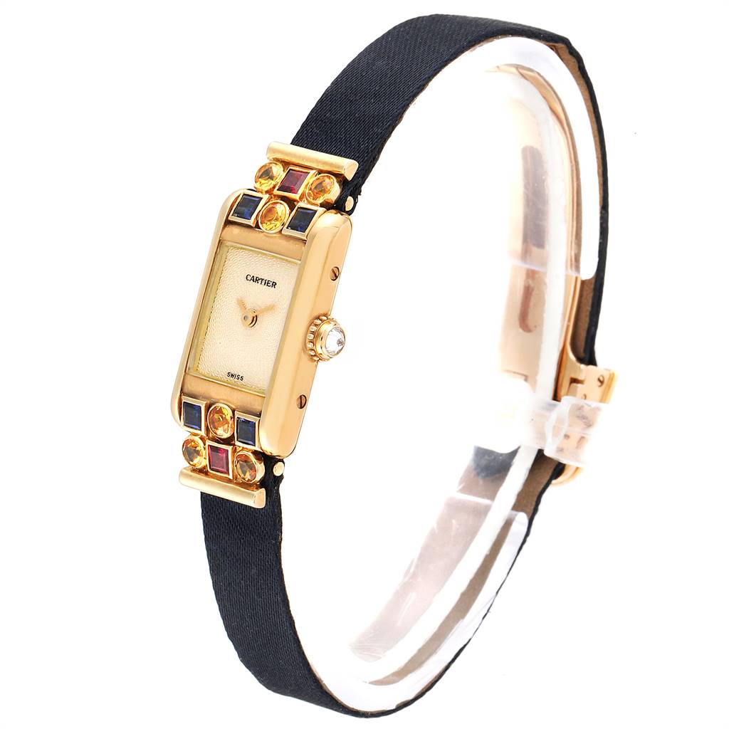 The image shows a side view of a Cartier Tank Louis 1360 Women
s Yellow Gold Silver Dial 1360 Women
s Yellow Gold Silver Dial watch, highlighting its detailed bezel and crown.