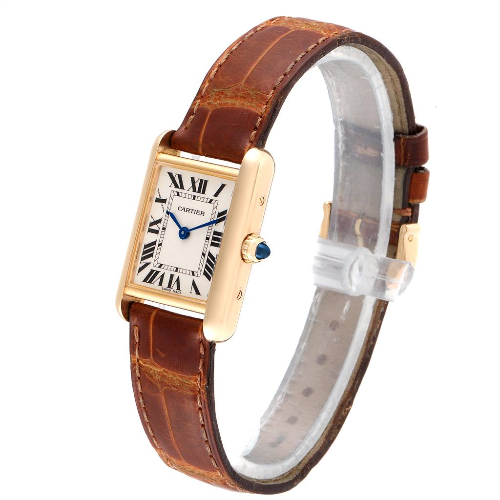 The image shows a Cartier Tank Louis W1529856 Women
s Yellow Gold Silver Dial W1529856 Women
s Yellow Gold Silver Dial watch with a gold rectangular case, Roman numeral dial, and brown leather strap, angled from the front-left.