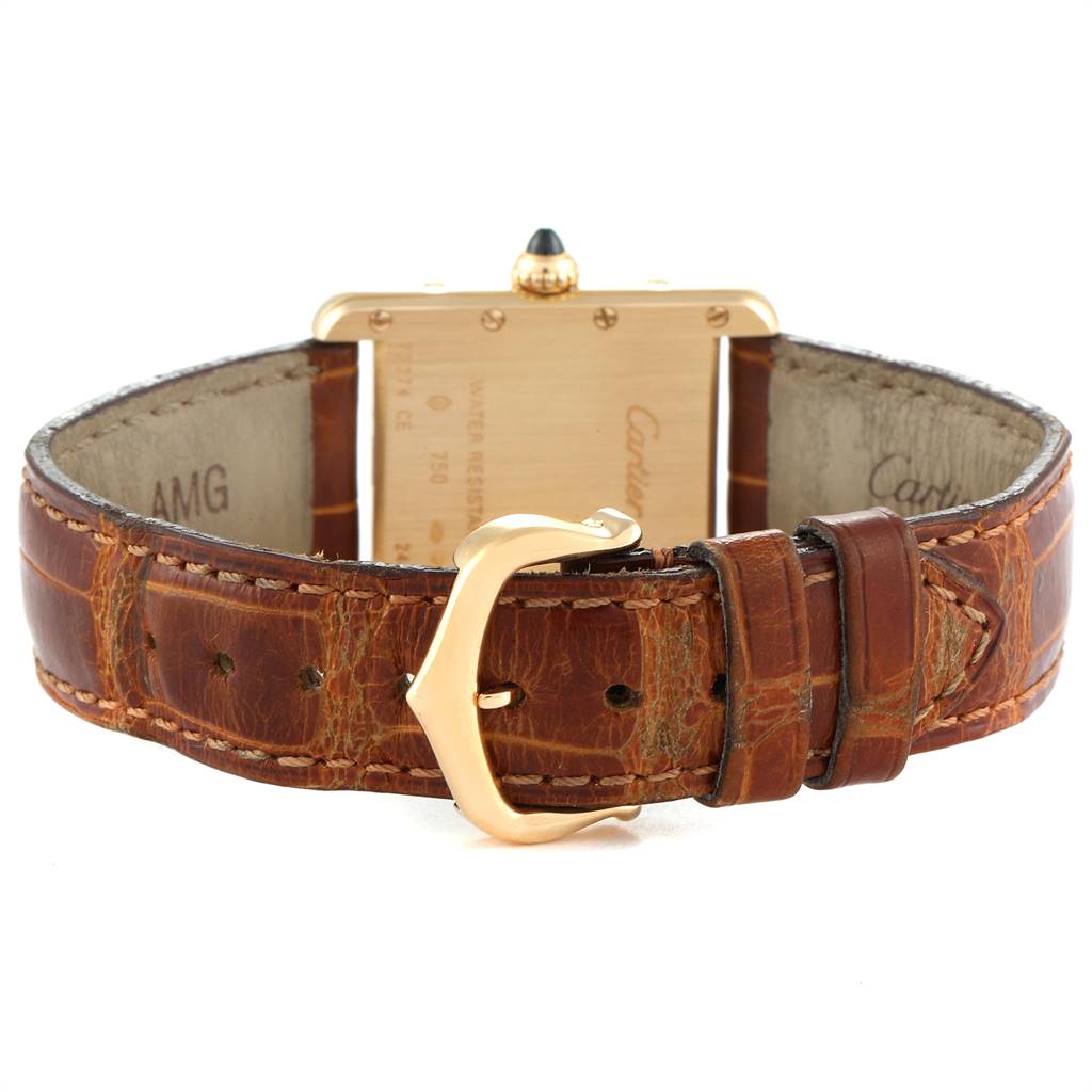 This image of the Cartier Tank Louis W1529856 Women
s Yellow Gold Silver Dial W1529856 Women
s Yellow Gold Silver Dial model shows the back of the watch and brown leather strap with a gold buckle.