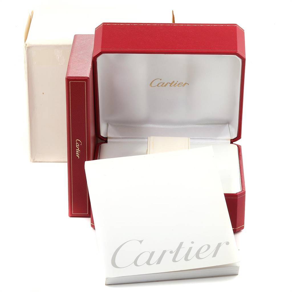 The image shows the packaging for a Cartier Tank Louis W1529856 Women
s Yellow Gold Silver Dial W1529856 Women
s Yellow Gold Silver Dial model watch, including a red watch box, white outer box, and documents.