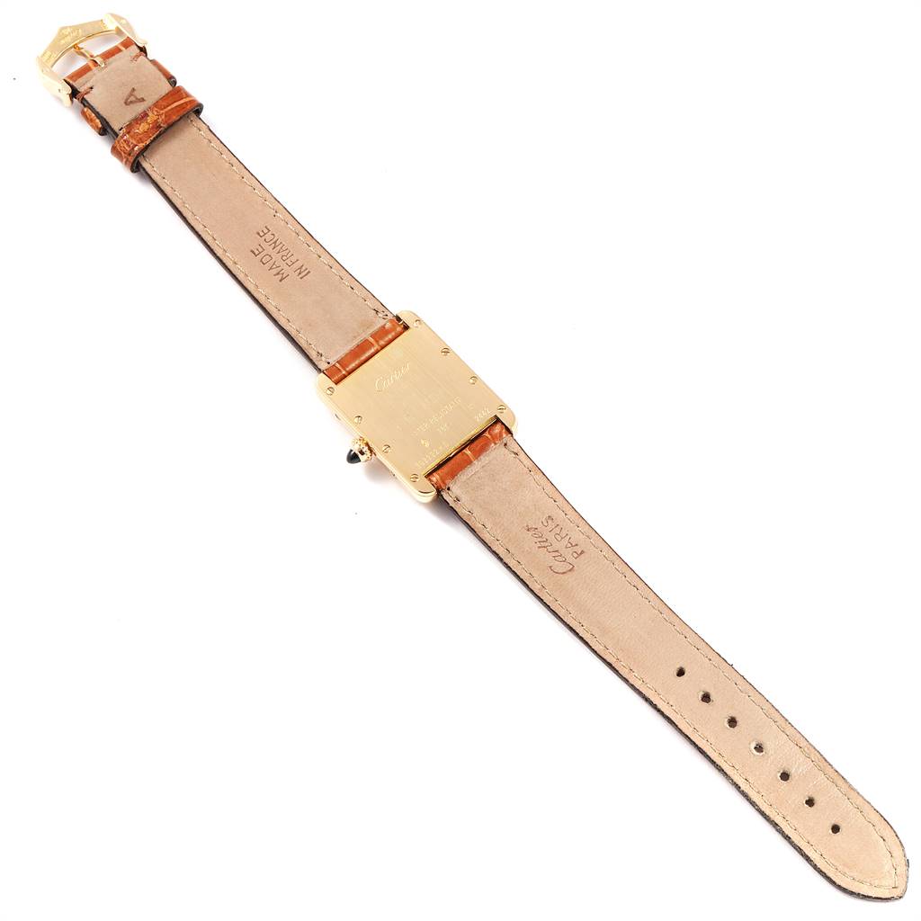 The image shows the back view of a Cartier Tank Louis W1529856 Women
s Yellow Gold Silver Dial W1529856 Women
s Yellow Gold Silver Dial watch, highlighting the leather strap and the watch
s metal case.