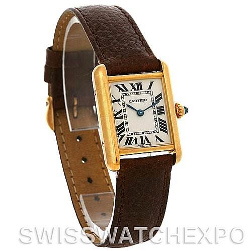 The image shows a Tank Louis model by Cartier at a slight angle, displaying the watch's rectangular face, strap, and part of the crown.
