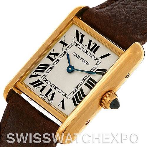 This image shows a Cartier Tank Louis W1529856 Women's Yellow Gold Silver Dial W1529856 Women's Yellow Gold Silver Dial model watch from a three-quarter angle, highlighting the face, Roman numerals, hands, crown, and leather strap.