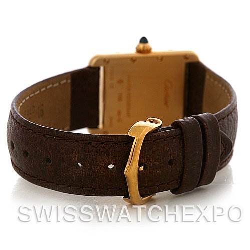 The image shows the back view of a Cartier Tank Louis W1529856 Women's Yellow Gold Silver Dial W1529856 Women's Yellow Gold Silver Dial watch, featuring its leather strap and gold buckle.