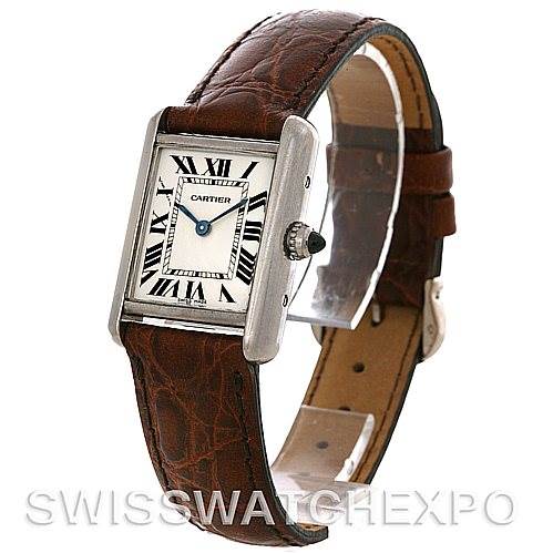 The image shows a Tank Louis model by Cartier, featuring its face, bezel, crown, and brown leather strap at a slight angle.