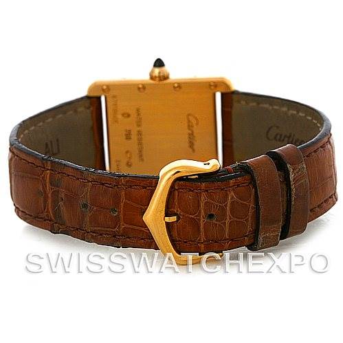 The image shows the back view of a Cartier Tank Louis W1529856 Women's Yellow Gold Silver Dial W1529856 Women's Yellow Gold Silver Dial watch, highlighting its brown leather strap and gold buckle.