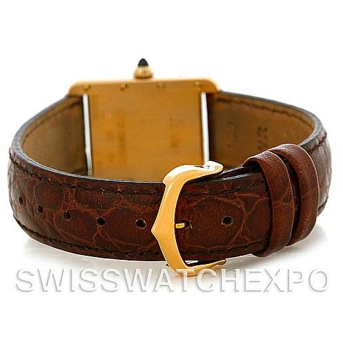 The image shows the back view of a Cartier Tank Louis W1529856 Women's Yellow Gold Silver Dial W1529856 Women's Yellow Gold Silver Dial watch, highlighting its leather strap and gold buckle.