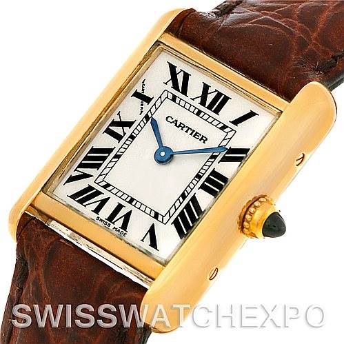 The image shows a close-up of the Cartier Tank Louis W1529856 Women's Yellow Gold Silver Dial W1529856 Women's Yellow Gold Silver Dial watch, featuring its rectangular face, Roman numerals, and leather strap.