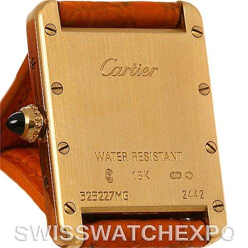 The image shows the backside of a Tank Louis watch by Cartier, highlighting the engravings and backplate details.