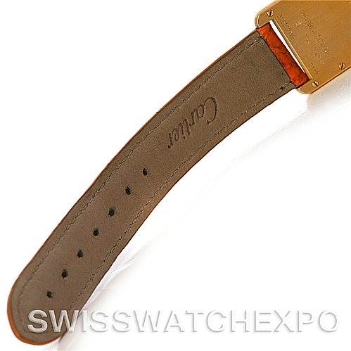 This image shows the underside of the leather strap and a portion of the gold caseback of a Cartier Tank Louis W1529856 Women's Yellow Gold Silver Dial W1529856 Women's Yellow Gold Silver Dial model.