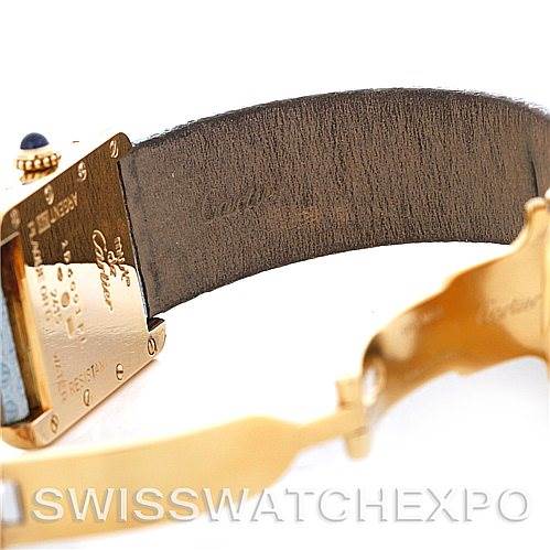 The image shows the back and part of the leather strap of the Cartier Tank Louis 2415 Women's Yellow Gold Blue Dial 2415 Women's Yellow Gold Blue Dial watch at an angle.