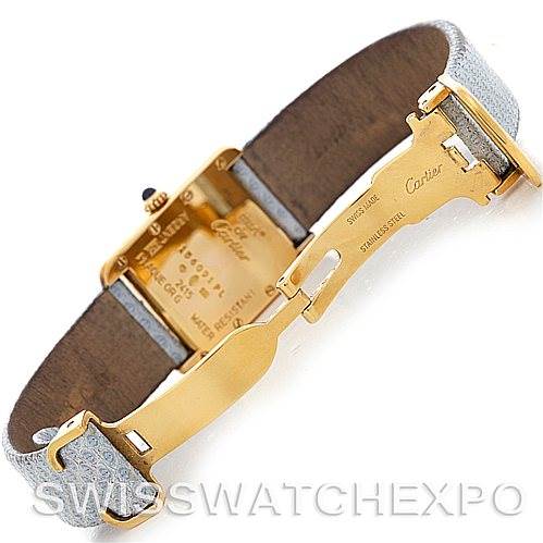 The image shows the back and clasp of a Cartier Tank Louis 2415 Women's Yellow Gold Blue Dial 2415 Women's Yellow Gold Blue Dial watch, highlighting the gold finish and detailed engravings.