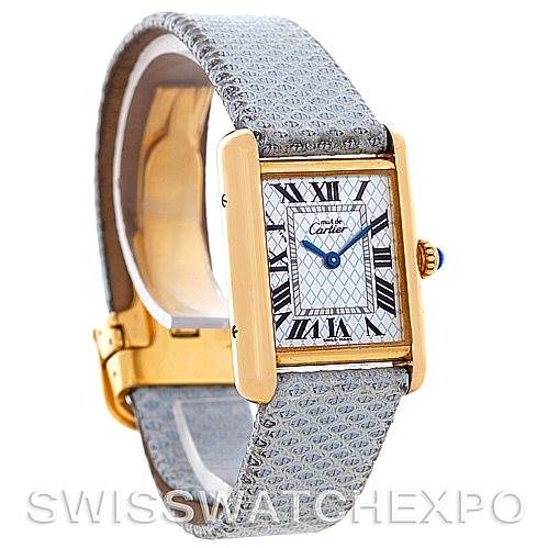 The Cartier Tank Louis 2415 Women's Yellow Gold Blue Dial 2415 Women's Yellow Gold Blue Dial watch is shown at an angled view, highlighting its rectangular dial, blue hands, Roman numerals, and textured strap.