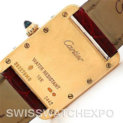 The image shows the back side and clasp of a Cartier Tank Louis W1529856 Women's Yellow Gold Silver Dial W1529856 Women's Yellow Gold Silver Dial watch, highlighting the brand name and specifications like 18K and water resistance.