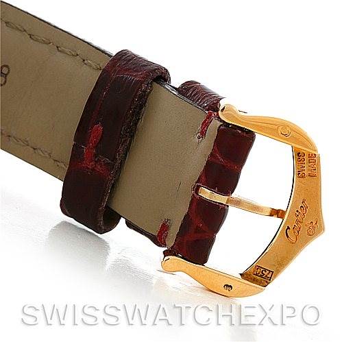 This image shows a close-up of the buckle and strap of a Tank Louis model watch by Cartier.