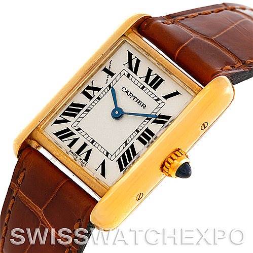 The image shows a close-up angle of the Cartier Tank Louis W1529856 Women's Yellow Gold Silver Dial W1529856 Women's Yellow Gold Silver Dial watch, highlighting the dial, case, and a portion of the leather strap.