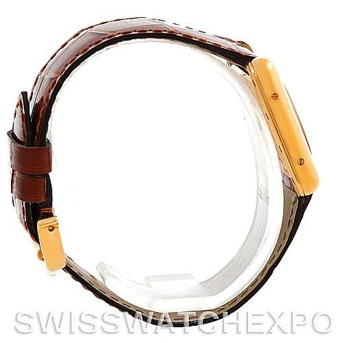 The image shows a side view of the Cartier Tank Louis W1529856 Women's Yellow Gold Silver Dial W1529856 Women's Yellow Gold Silver Dial watch, highlighting the case, crown, and leather strap.