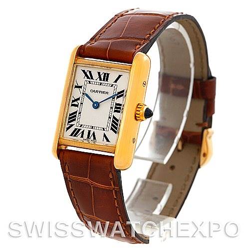 The image shows a Tank Louis model by Cartier at a slight angle, displaying the face, case, leather strap, and crown.