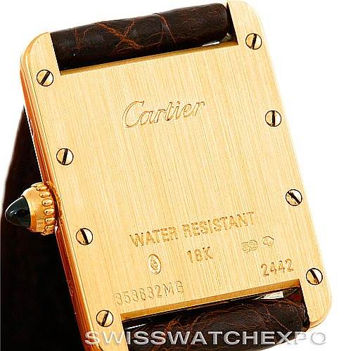 The image shows the back case of a Cartier Tank Louis W1529856 Women's Yellow Gold Silver Dial W1529856 Women's Yellow Gold Silver Dial watch, highlighting its gold casing, screws, and water-resistant markings.