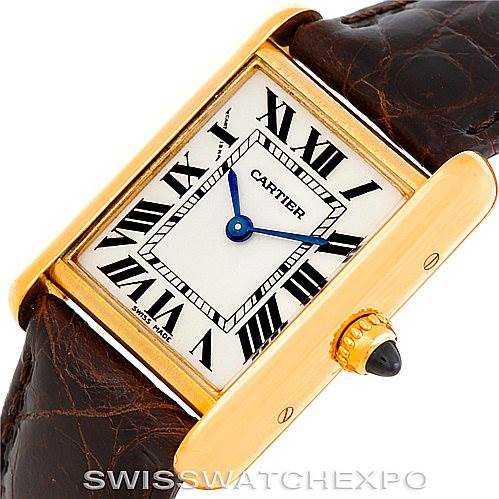 This image shows a close-up angled view of the Cartier Tank Louis W1529856 Women's Yellow Gold Silver Dial W1529856 Women's Yellow Gold Silver Dial watch, highlighting its face, Roman numerals, and a portion of the strap.