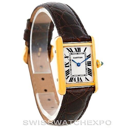 The image shows a Cartier Tank Louis W1529856 Women's Yellow Gold Silver Dial W1529856 Women's Yellow Gold Silver Dial watch at an angle highlighting the face, bezel, crown, and strap.