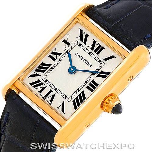 The image shows a close-up, angled view of the Cartier Tank Louis W1529856 Women's Yellow Gold Silver Dial W1529856 Women's Yellow Gold Silver Dial watch, highlighting its rectangular dial and gold casing with a crown.