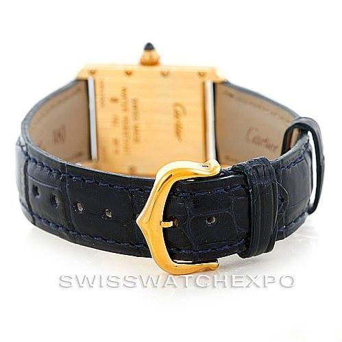 The image shows the back view of the Cartier Tank Louis W1529856 Women's Yellow Gold Silver Dial W1529856 Women's Yellow Gold Silver Dial watch, focusing on its leather strap and gold buckle.