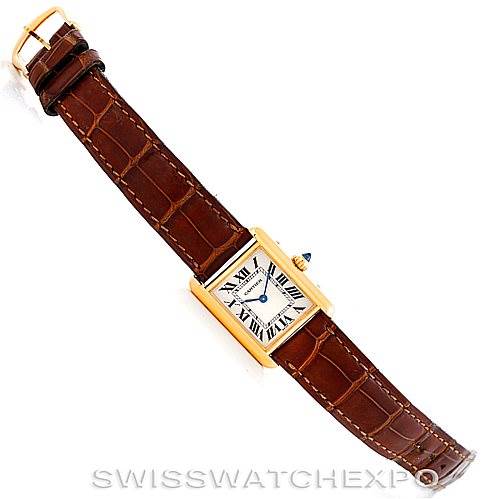 The image shows a Cartier Tank Louis W1529856 Women's Yellow Gold Silver Dial W1529856 Women's Yellow Gold Silver Dial watch at an angled top-down view, highlighting the case, dial, strap, and buckle.