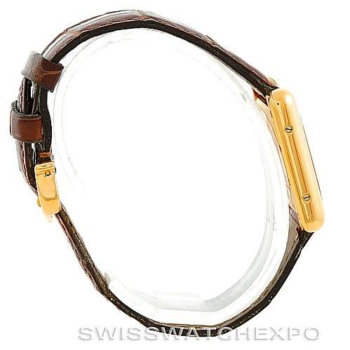 The image shows a side view of the Cartier Tank Louis W1529856 Women's Yellow Gold Silver Dial W1529856 Women's Yellow Gold Silver Dial model, highlighting the case, buckle, and leather strap.