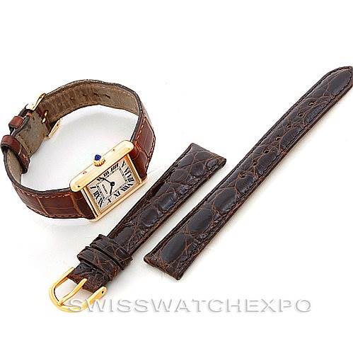 The image shows a Cartier Tank Louis W1529856 Women's Yellow Gold Silver Dial W1529856 Women's Yellow Gold Silver Dial watch laid flat, along with two additional brown leather straps.