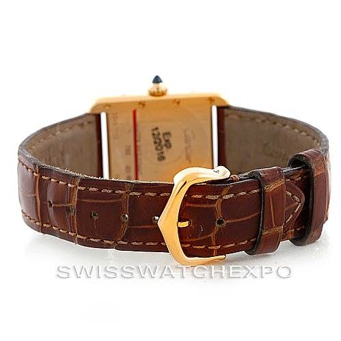 This image shows the back and clasp of the Cartier Tank Louis W1529856 Women's Yellow Gold Silver Dial W1529856 Women's Yellow Gold Silver Dial watch, featuring a brown leather strap and gold buckle.