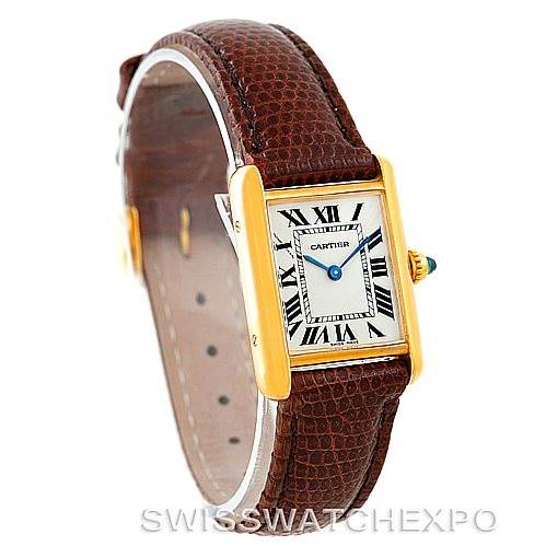The image shows a Cartier Tank Louis W1529856 Women's Yellow Gold Silver Dial W1529856 Women's Yellow Gold Silver Dial model watch at a three-quarter angle, highlighting its gold case, Roman numeral dial, and brown leather strap.