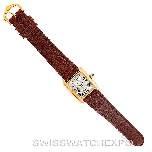 This image shows a top-down view of the Cartier Tank Louis W1529856 Women's Yellow Gold Silver Dial W1529856 Women's Yellow Gold Silver Dial model watch with its brown leather strap and rectangular face.