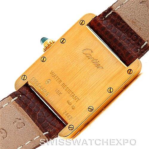 This image shows the back case and leather straps of a Cartier Tank Louis W1529856 Women's Yellow Gold Silver Dial W1529856 Women's Yellow Gold Silver Dial watch, including the engravings and details on the back.