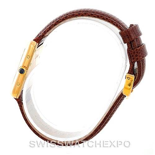 The image shows the side view of a Cartier Tank Louis W1529856 Women's Yellow Gold Silver Dial W1529856 Women's Yellow Gold Silver Dial watch, highlighting its gold case, crown, and brown leather strap.