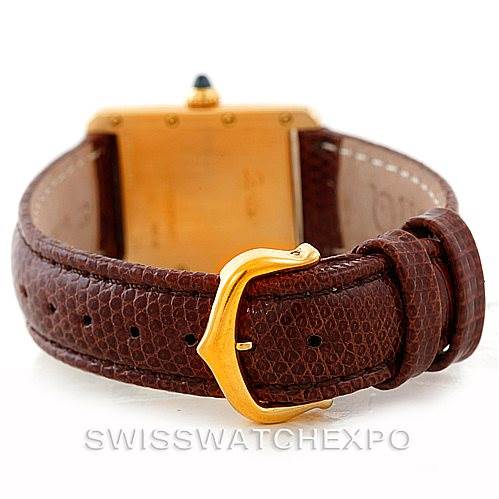 The image shows the back view of a Cartier Tank Louis W1529856 Women's Yellow Gold Silver Dial W1529856 Women's Yellow Gold Silver Dial watch with a brown leather strap and gold buckle.