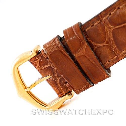 This image shows a close-up of the strap and buckle of a Cartier Tank Louis W1529856 Women's Yellow Gold Silver Dial W1529856 Women's Yellow Gold Silver Dial watch.