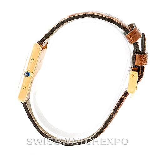 This image shows a side view of the Tank Louis model by Cartier, highlighting the watch's profile, strap, and crown.